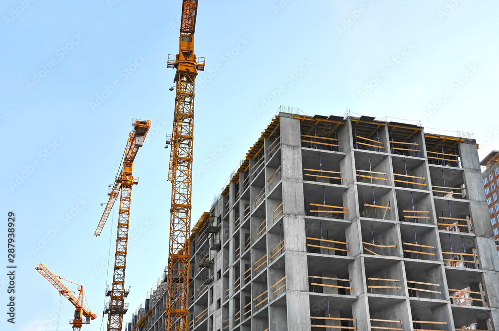 Crane and highrise construction site