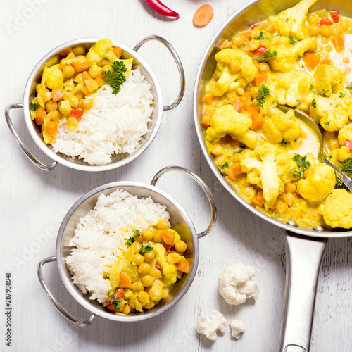 Vegetarian curry with cauliflower and chickpeas, healthy homemade vegan food, indian cuisine, clean eating concept