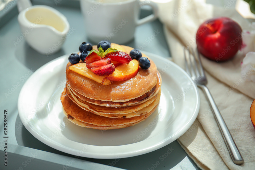 Plate with tasty pancakes on table Plate with tasty pancakes on table