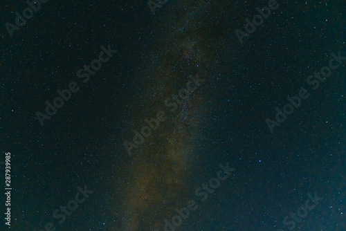 Colorful space shot showing the universe milky way galaxy with stars and space dust.