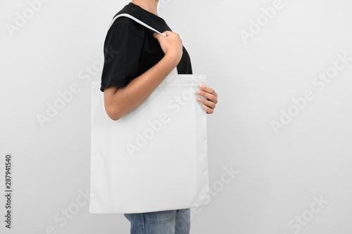 hipter woman holding eco fabric bag isolate on white background photo