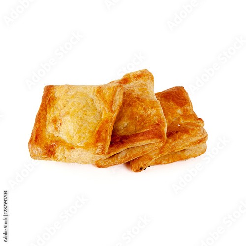 Group of freshly puff pastry buns baked isolated on white background