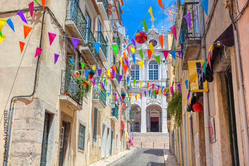 Fototapeta Naklejka Na Ścianę i Meble -  colorful flags over the street in Lisbon 