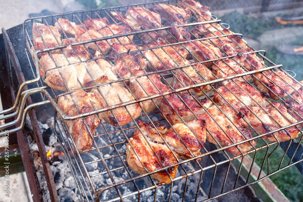 Meat pork beef on the grill cooking process barbecue. traditional outdoor recreation.