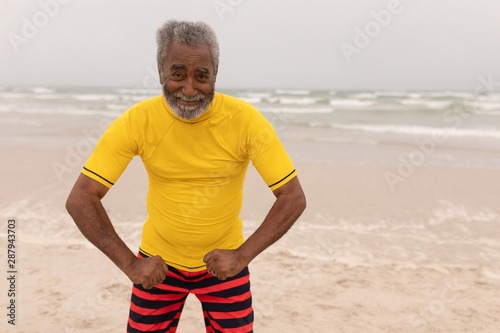 Senior man posing on the beach