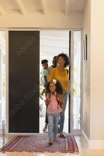 Happy African American family returning sweet home