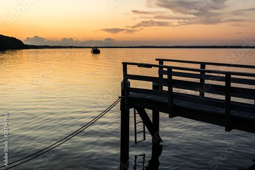 Wooden pier at the Baltic Sea during a beautiful colorful sunset