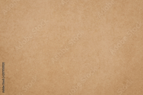 Old paper texture. Brown parchment surface. Yellow packaging background, dirty card backdrop. Vintage paper sheet pattern. © tatyana