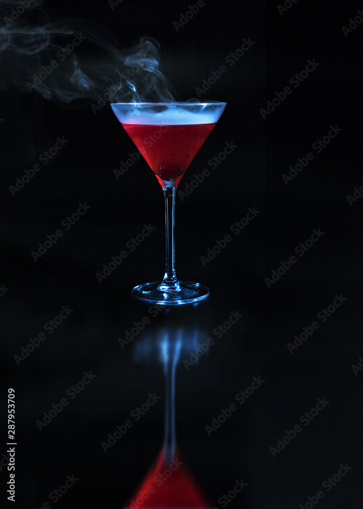 Wineglass with redÂ drink and reflection on surface
