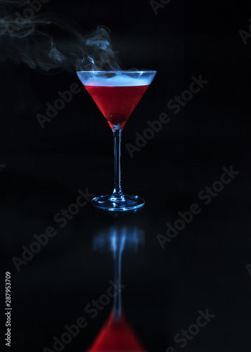 Wineglass with redÂ drink and reflection on surface