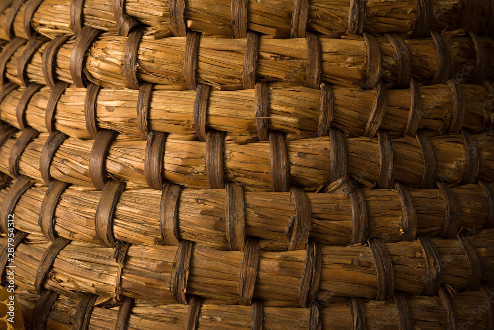 Obraz premium Vintage beehive basket closeup