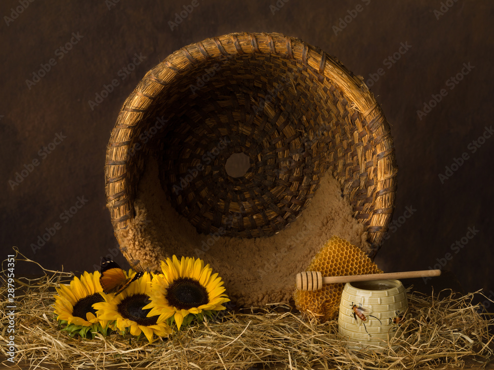 Open beehive basket and flowers Stock Photo | Adobe Stock