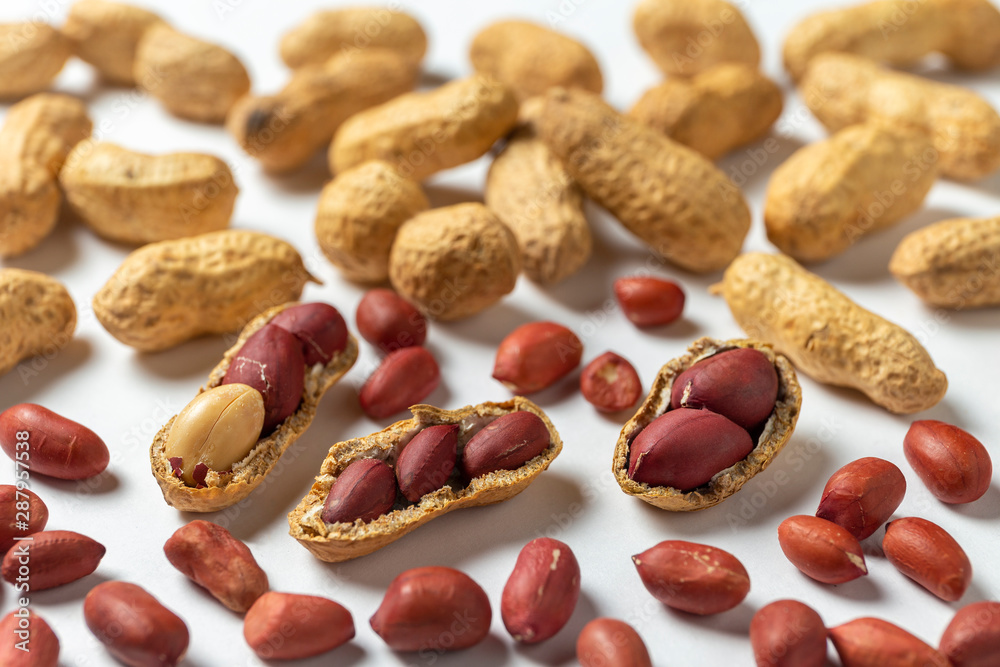 Grout of peanuts on the white background Grout of peanuts on the white background