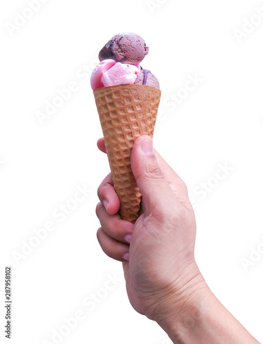 Hand holding an strawberry or cherry and chocolate ice cream scoops with cone isolated on white background. with clipping path.