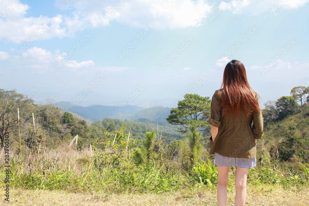 A asian girl is traveling alone in the forest. A broken heart girl.