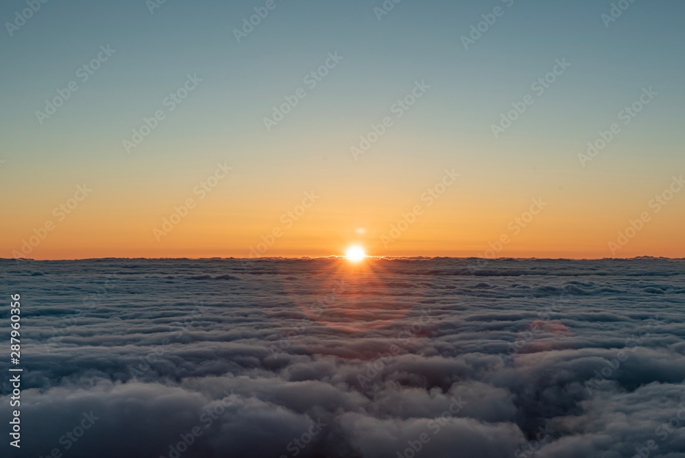 Fototapeta premium sunrise over the fluffy clouds with beautiful colours