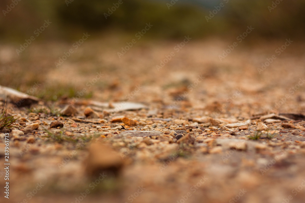 macro detail of soil with small stones in orange and gray macro detail of soil with small stones in orange and gray