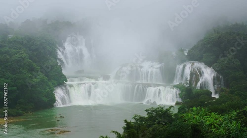 Bird eye view Bangioc waterfall in Vietnam and Detian waterfall with mist surround in China, located near border, people can see this waterfall both of country, Lockdown..