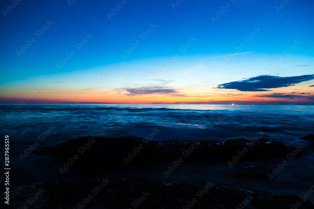 Silhouette sunset sea beach colorful sky