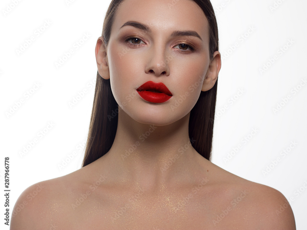 Close-up portrait of sexy european young woman model with classic glamour make-up and red lipstick. Dark long hairstyle, christmas makeup, dark eyeshadows, bloody red lips with gloss Close-up portrait of sexy european young woman model with classic glamour make-up and red lipstick. Dark long hairstyle, christmas makeup, dark eyeshadows, bloody red lips with gloss