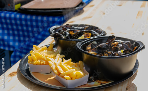 Traditional dish on Lille Braderie, mussels and fries (moules frites).Great Lille Braderie (Braderie de Lille).