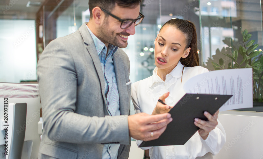 Two business partners discussing issues at a meeting in an office