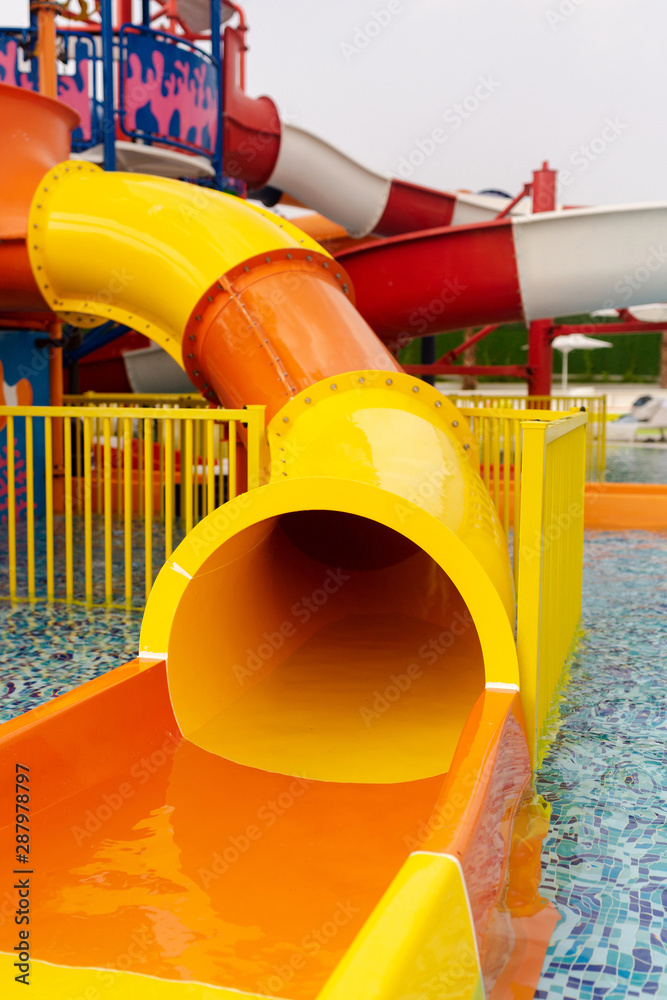 Aquapark sliders for children with pool.