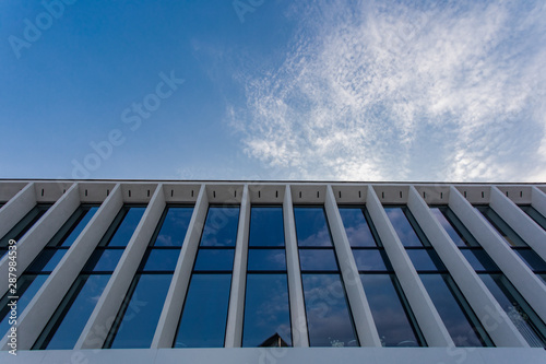 sky and exterior glass wall modern building. Modern office building