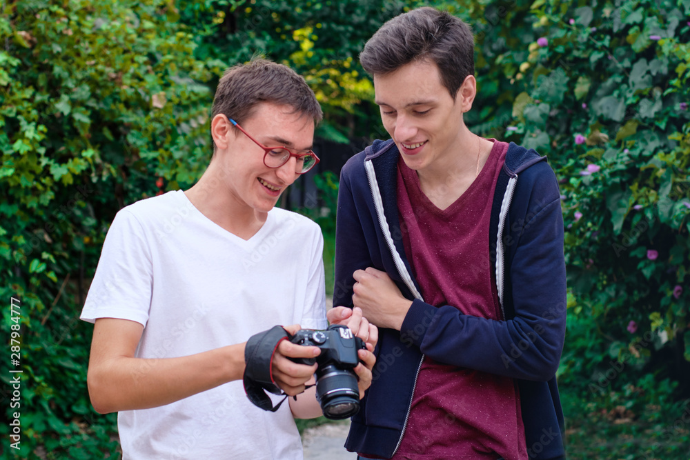Young man photographer having a conversation Young man photographer having a conversation