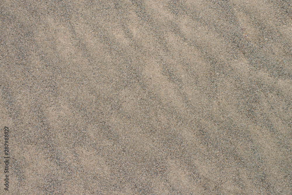Natural sandy beach background with wavy texture Natural sandy beach background with wavy texture
