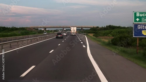 FPV: Driving along the highway. View of the road from the car window. Cars go to a meeting.