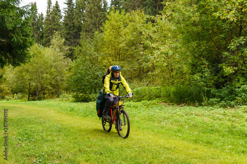 bicycle tourist in the autumn forest