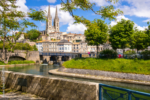 A view of Niort from the quay of Sevre Niortaise river, Deux-Sevres, Poitou-Charentes region, France photo