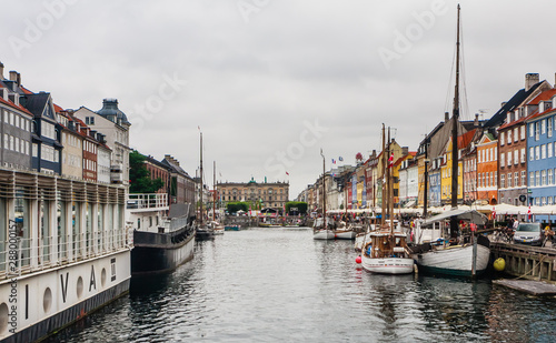 The boats and ships in the calm hurbour of Nyhavn, Copenhagen, Denmark.