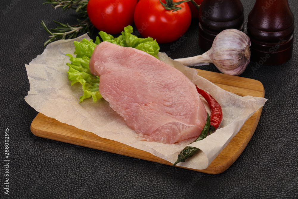 Raw Turkey steak served rosemary Raw Turkey steak served rosemary