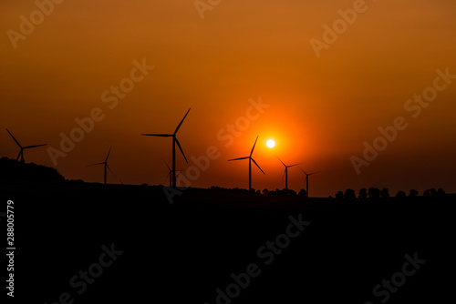 Wind turbines at sunset