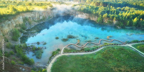Fototapeta Naklejka Na Ścianę i Meble -  Aerial landscape from the drone - blue water inside old mine