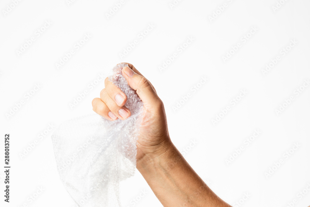 male hand popping bubble wrap isolated in white background