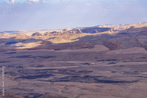 Wide panorama of the Makhtesh Ramon, Makhtesh Ramon, a geological feature of Negev desert, in Israel. Natural sightseeing