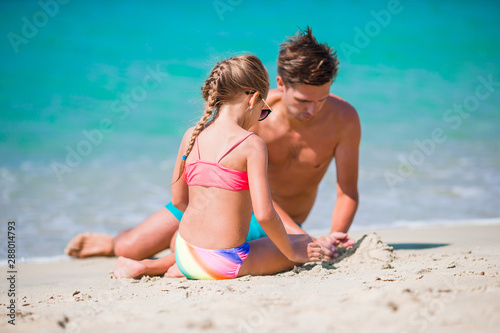 Beautiful father and daughter on european beach