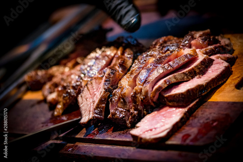 Cut ancho steak. Ancho steak on the board. BBQ Medium Rare ancho Steak.