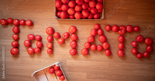 Word TOMATO made of raw fresh organic tomatoes © Milan