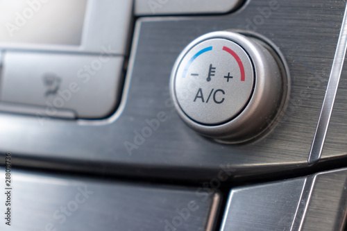 Temperature control knob in car air conditioning system close up, comfort and fresh air in vehicle cabin