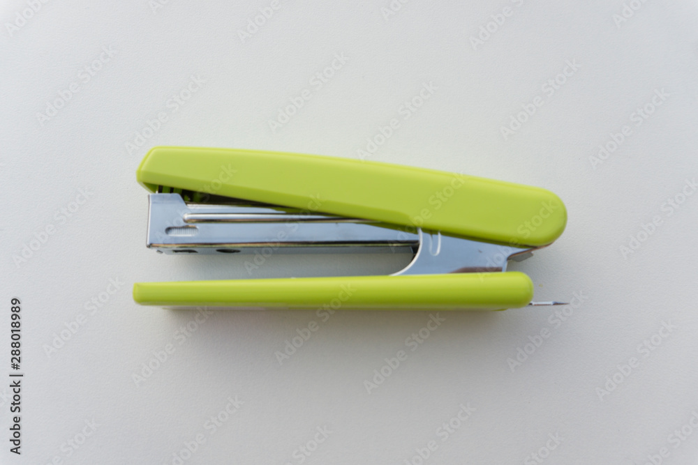 Green stapler isolated on white background. Green stapler isolated on white background.