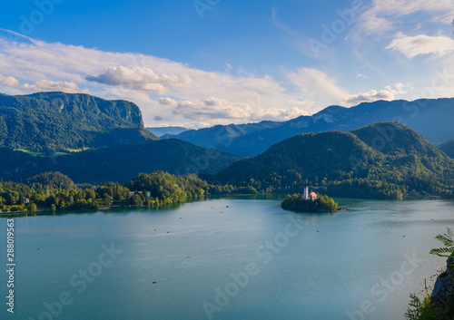 Beautiful landscape of the mountain Lake Bled during sunset from the wall of a medieval castle, located on the shore of the lake.