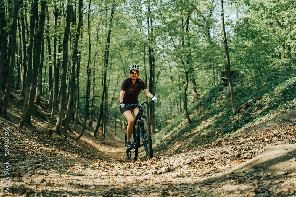 Fototapeta premium Women is riding on bicycle.