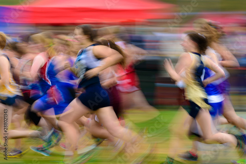 Fotografie Group of female athletes running.