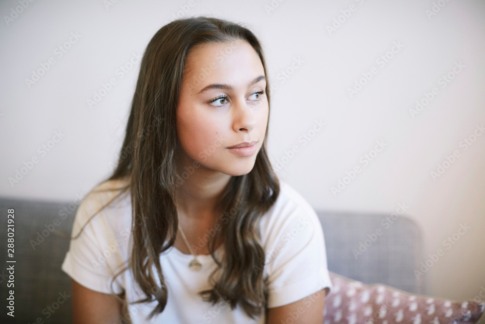 Thoughtful teenage girl sitting at wellness center Thoughtful teenage girl sitting at wellness center