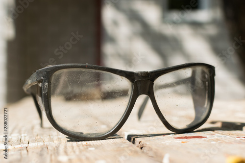 Safety glasses for worker safety when working with cutting power tools for construction and repair