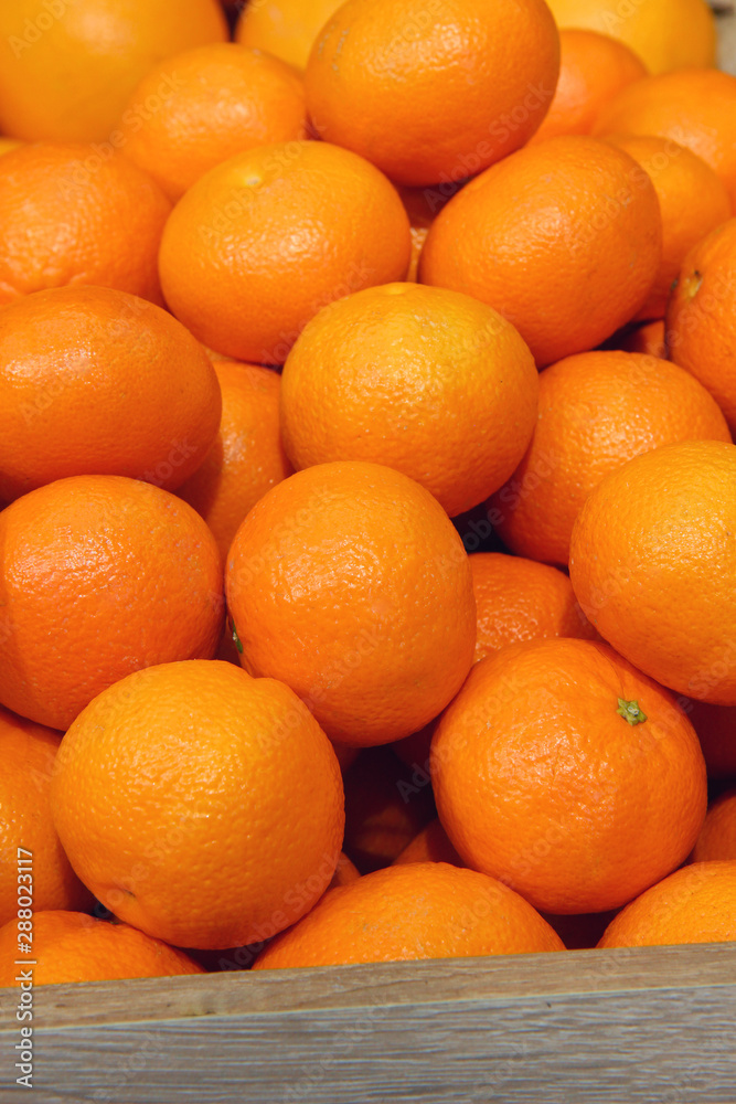 A crop of fresh mandarins background close up A crop of fresh mandarins background close up